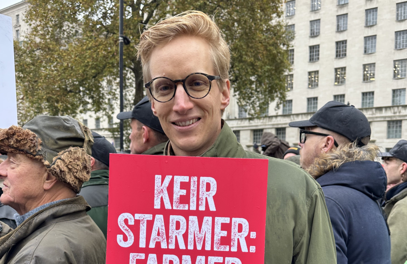 James holds placard at protest