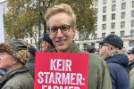 James holds placard at protest